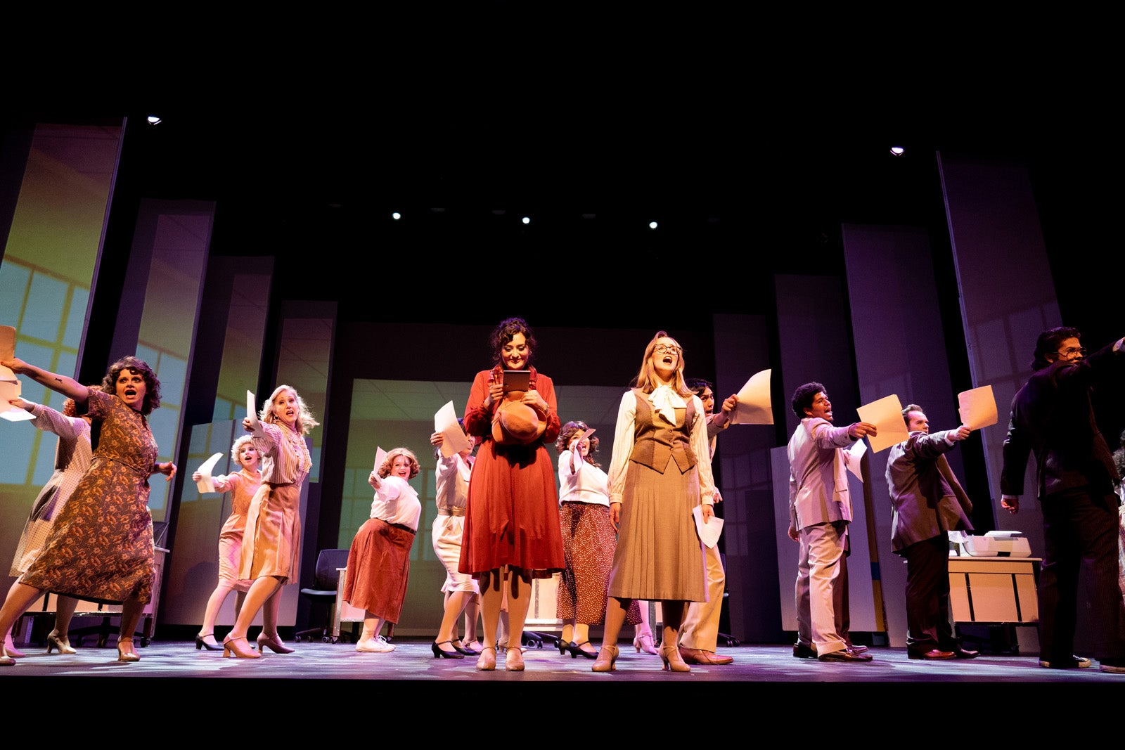 Actors performing on the Rezanoor Stage during the IVC Theater production of 9to5.