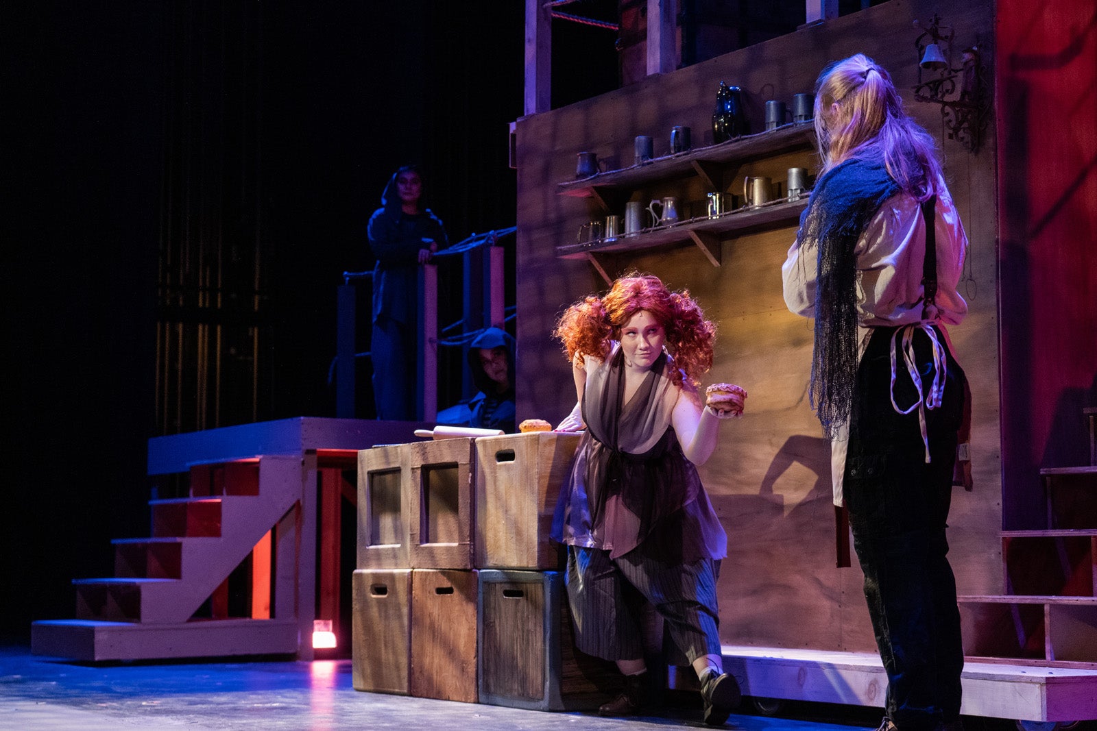 Actors from the IVC Theater production of Sweeney Todd performing on stage.