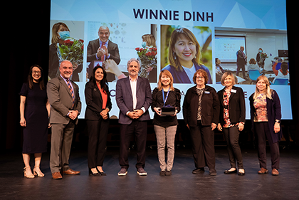 Winnie Dinh receiving award 