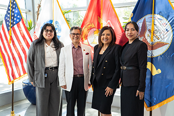 IVC administraor and staff posing with Keynote Speaker of Women Veterans Networking Forum 