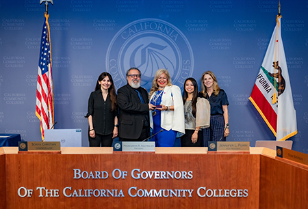 Desiree Ortiz receiving her award at the California Community Colleges Board of Governernors meeting 