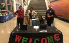Entrepreneurship students and faculty at welcome booth 