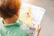Young boy looking at a map 