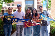 IVC students holding college pennants