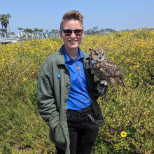 Kass Malcor holding owl