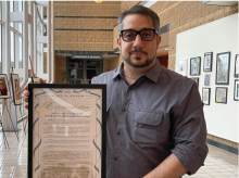 Pooris holding commendation from City of Irvine 