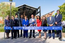 Board of Trustees and Campus Leaders posing at ribbon cutting ceremony 